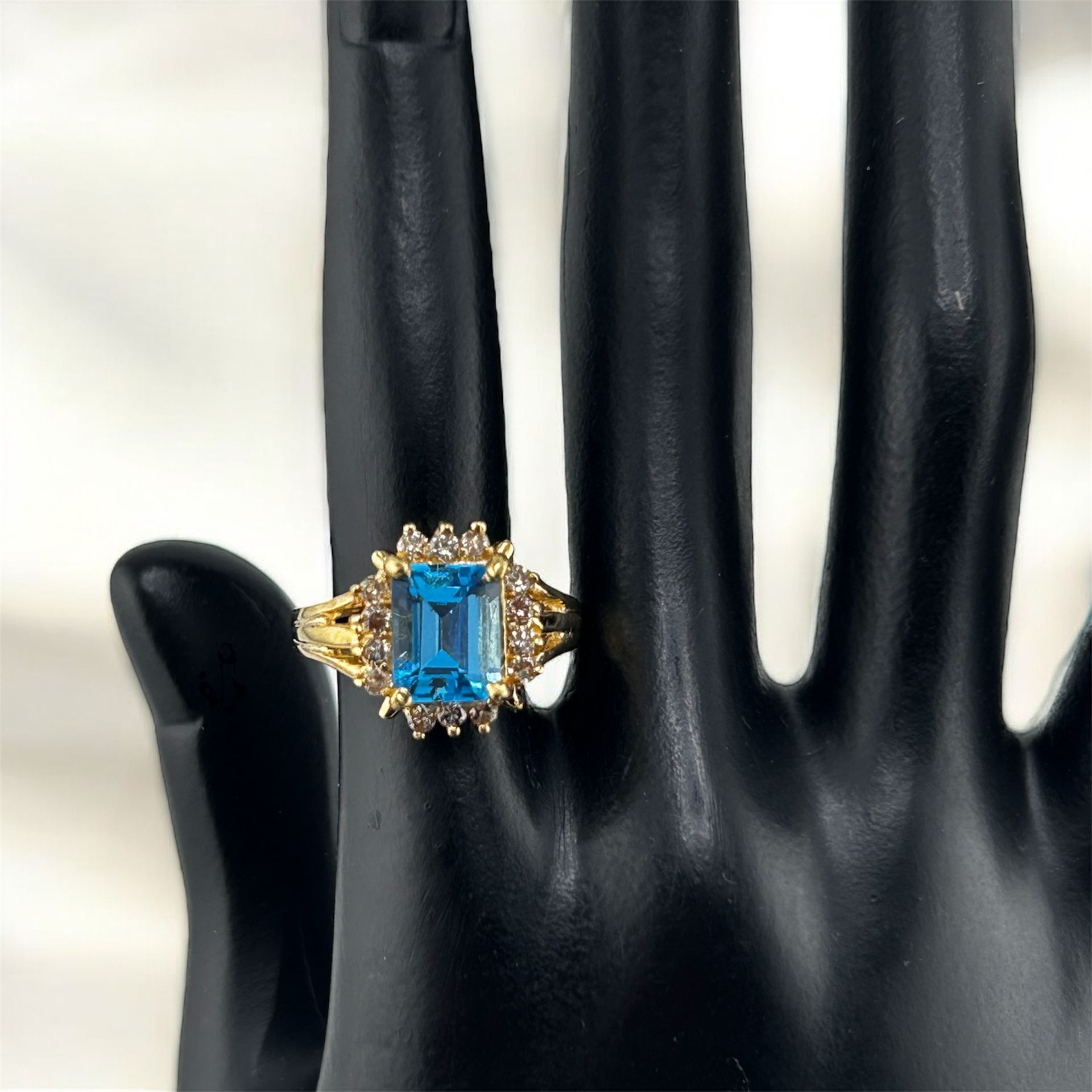 Emerald-Cut Blue Topaz and Diamond Halo Ring