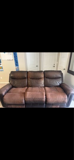 Brown leather reclining couch