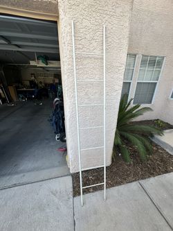 Metal Ladder 12 1/2” Wide x 79” tall.  Paint has some scratches. If you see it listed it’s still available. 