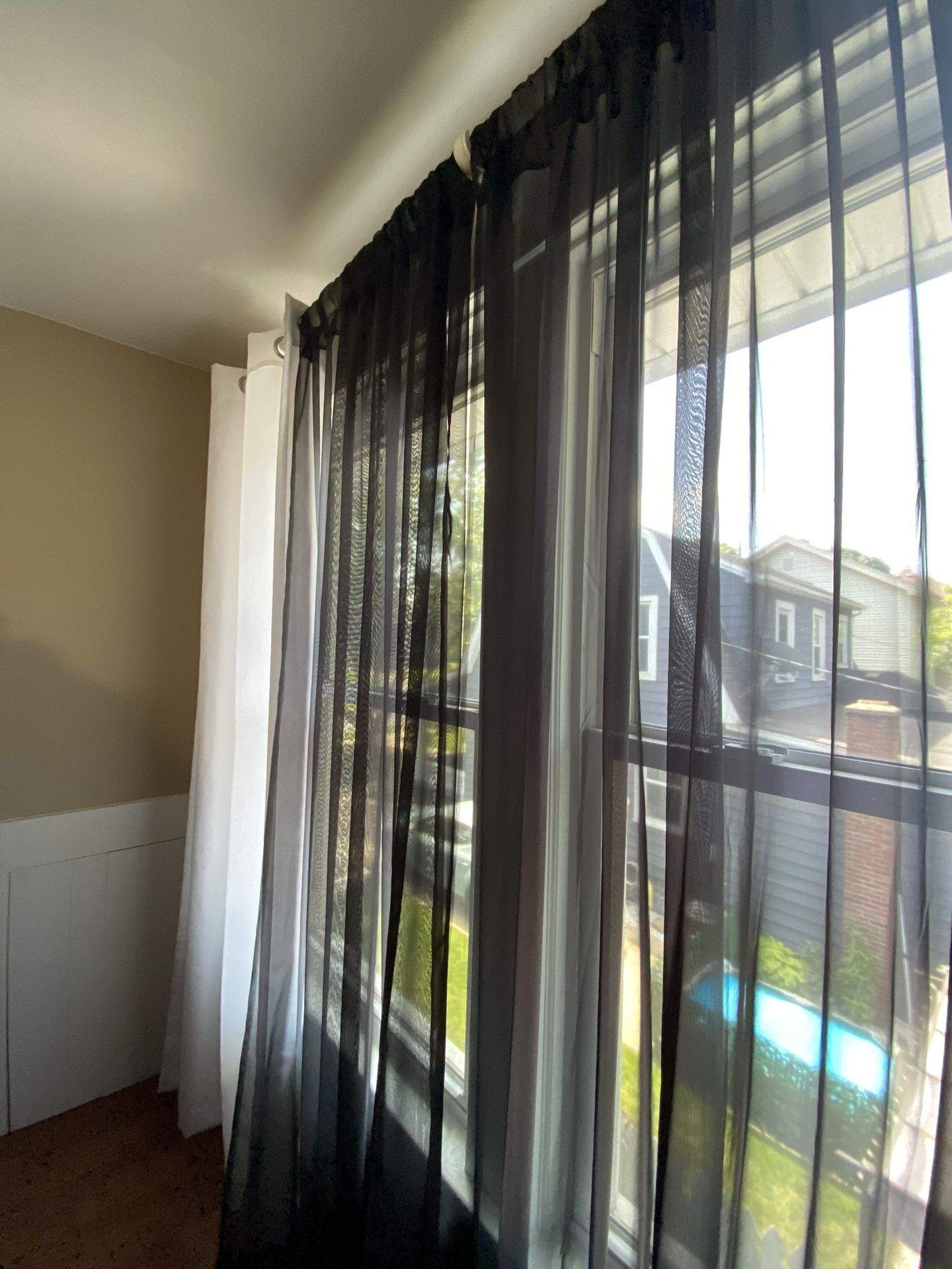  2 white curtain  panels and 2 Black Sheer Curtains  84 inch long 