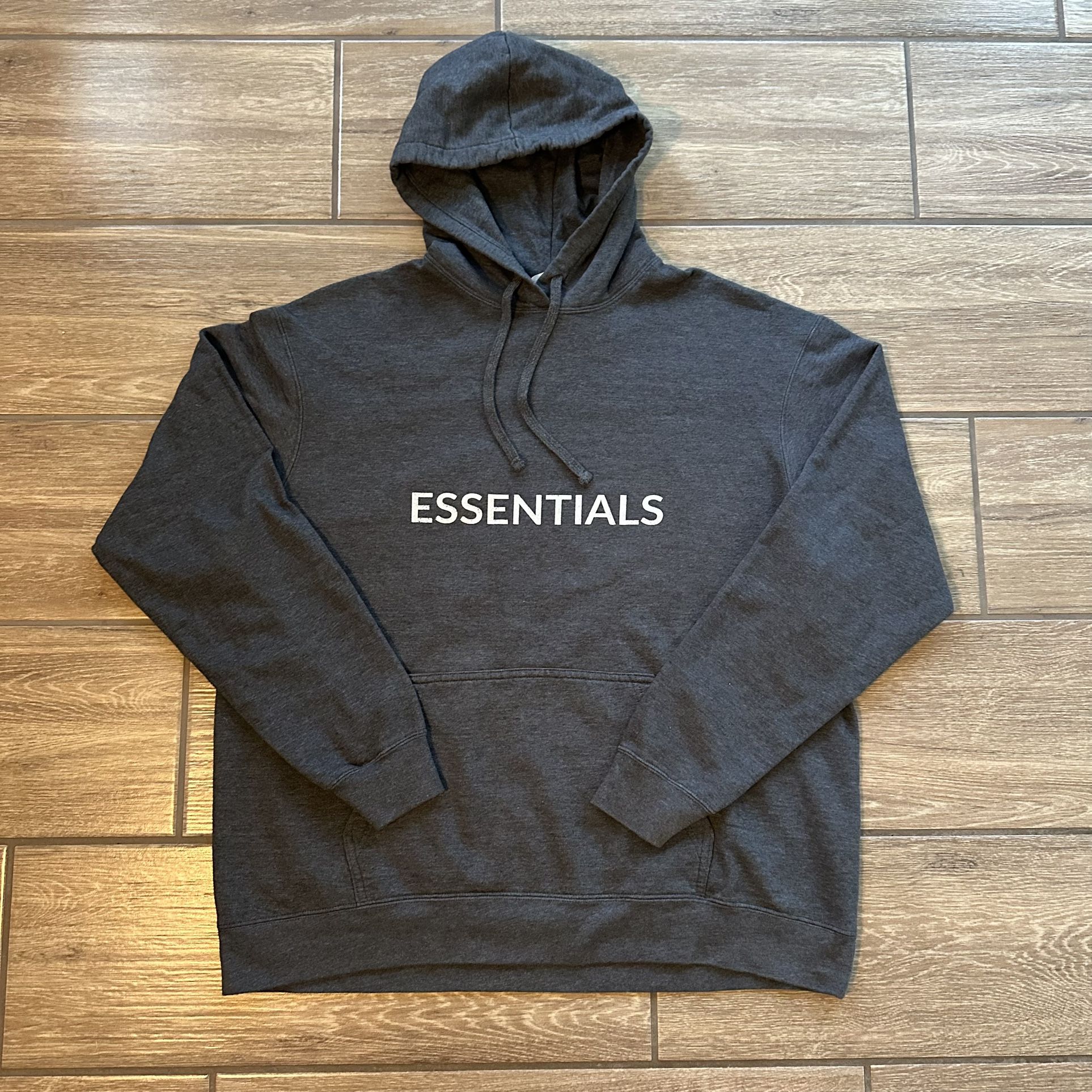 The ESSENTIALS Hoodie in XL size from Port & Company is a fan favorite with a custom print. Made from a blend of polyester and cotton with a fleece fa