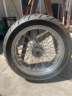 1 HARLEY DAVIDSON WHEEL,  2 TRIUMP WHEELS