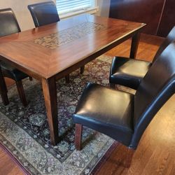 solid wood dinning room table and 8 chairs