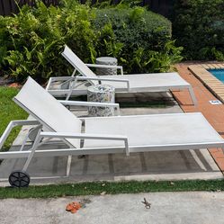 Two outdoor lounge chairs