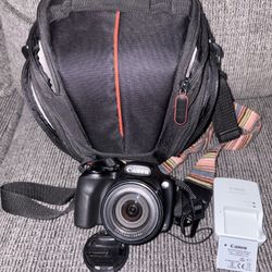     Canon PowerShot Camera + Charger + Case 