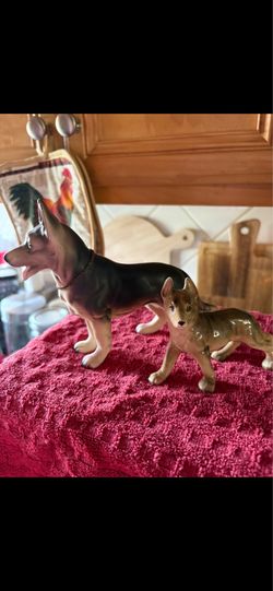 THREE GERMAN SHEPHERD STATUES