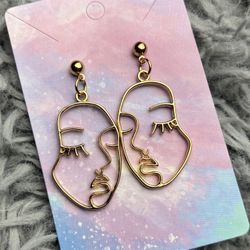 face portrait earrings
