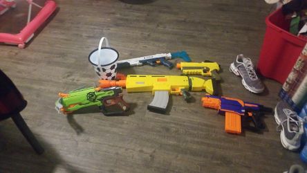 Nerf guns with a bucket of bullets