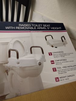 Raised toilet seat with removable arms