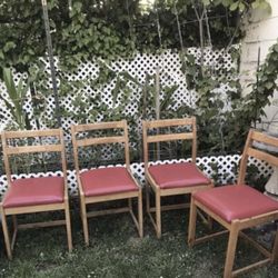 4 red wood leather chairs