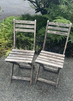 2 wooden outdoor chairs
