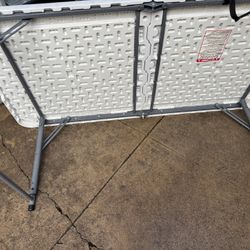 Folding Table 4 Feet Long In Good Condition A Little Scratched But Still Good Asking For $10