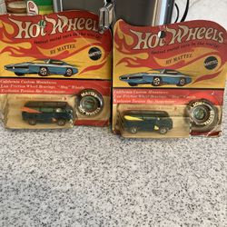 Two Hot Wheel Vans With Surfboards On The Sides