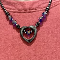 Women’s Jewelry. Hermatite Heart Pendant Necklace with Iridescent Purple Beads.