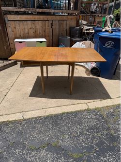 Mid Century Modern Wooden Drop Leaf Table, opens to 63 by 40, closed is 27 by 40, 29 hi, $80