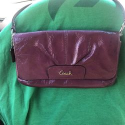 Plum coach wristlet