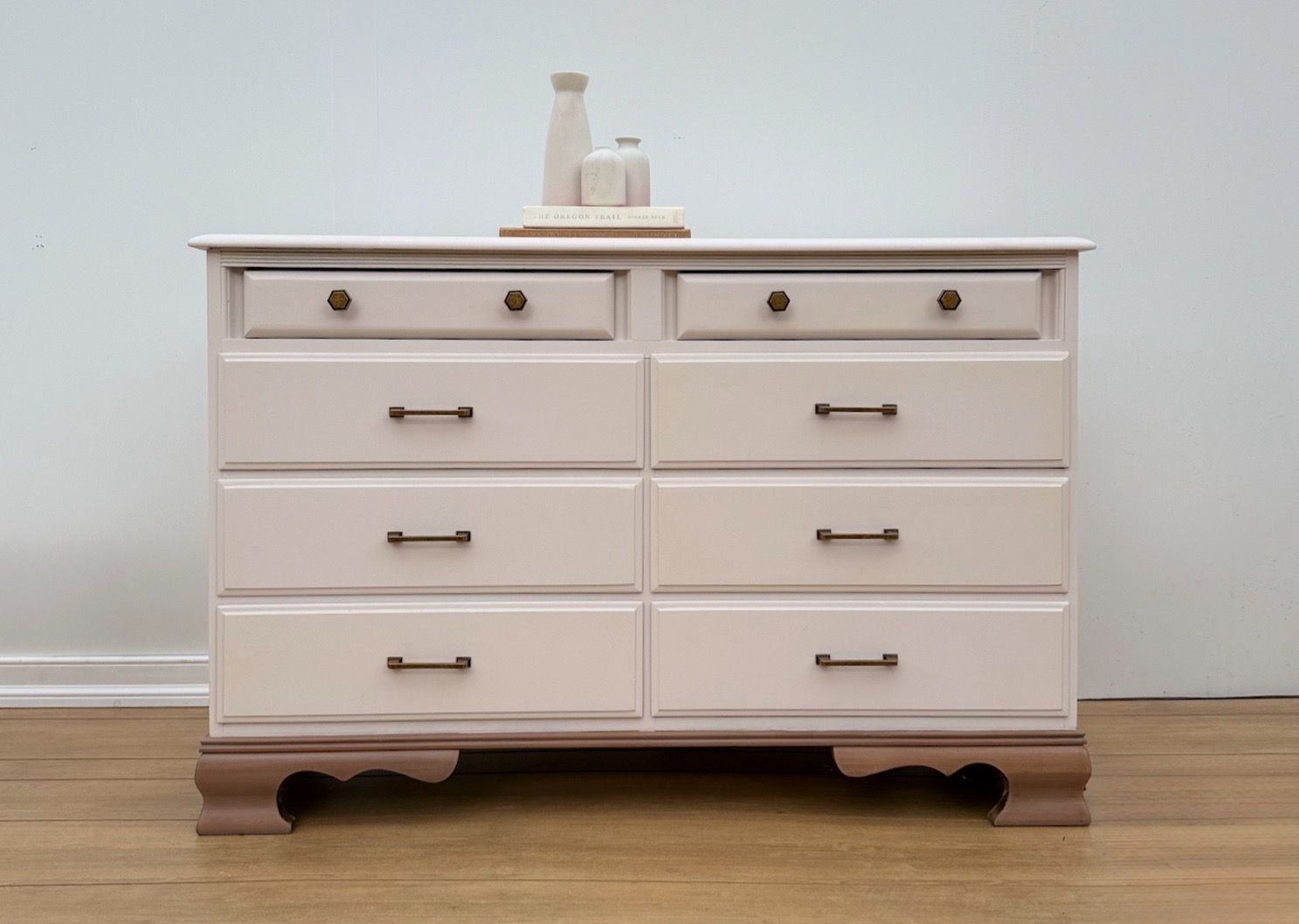 Neutral dresser with natural wood base