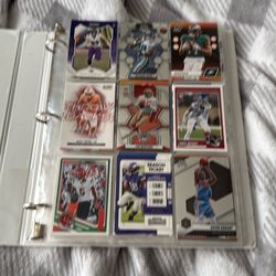 Sports cards, football baseball and basketball. There’s extra pages I couldn’t take that many pictures.