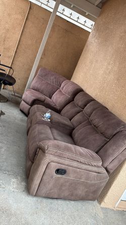 Two piece couch. Used comes with charging outlets
