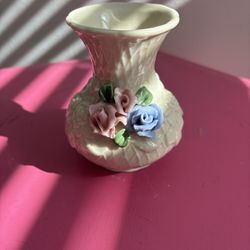 vintage porcelain bud vase,, featuring a raised floral design with pink and blue sculpted roses