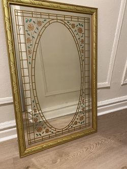Gold Colored Mirror With Floral Design