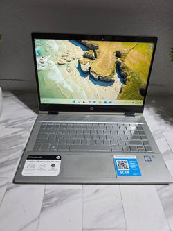 HP Pavilion x360 laptop. Has a 360-degree hinge for different modes. Features Intel Core i5 8th Gen processor. Keyboard is backlit. Audio is B&O tuned