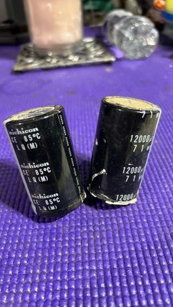 Nichicon and the capacitors are 12,000 µF, 85°C aluminum electrolytic capacitors.