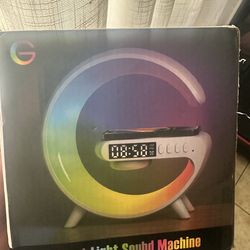 New  in box  sound /clock/Charger