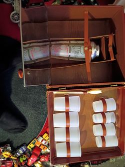 A vintage mid-century portable travel bar set or "Portable Pub" inside a brown faux-leather hard-shell carrying case. ONLY $200. Generally retails for