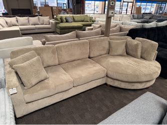 Tan sectional with round chaise lounge