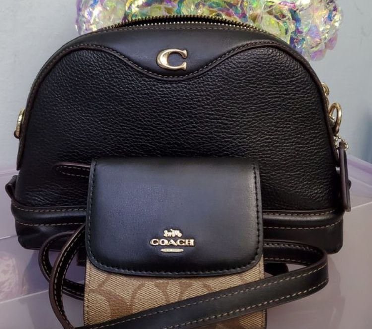 $95 Coach crossbody and wallet. Used a few times basically brand New