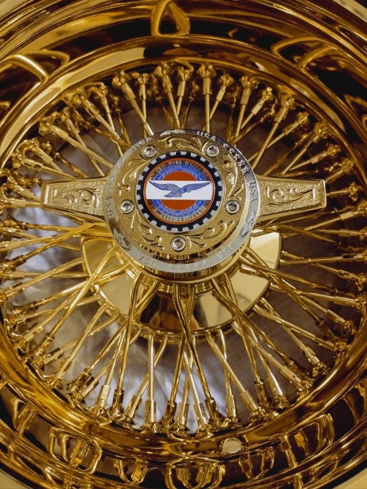 New engraved gold and chrome Zenith style spoke wire wheel knockoffs for lowrider