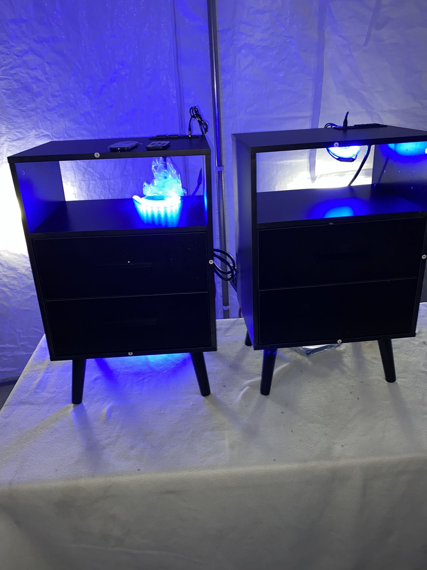 matching pair set of black small nightstands with LED and usb/power connection on top
