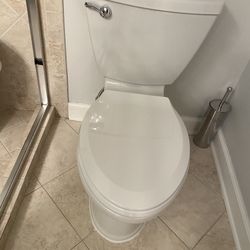 Two American Standard Toilet 