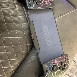 Gammeefy JC200 handheld controller for the Nintendo Switch or Switch OLED. It features a flame-patterned RGB lighting design and acts as a one-piece J