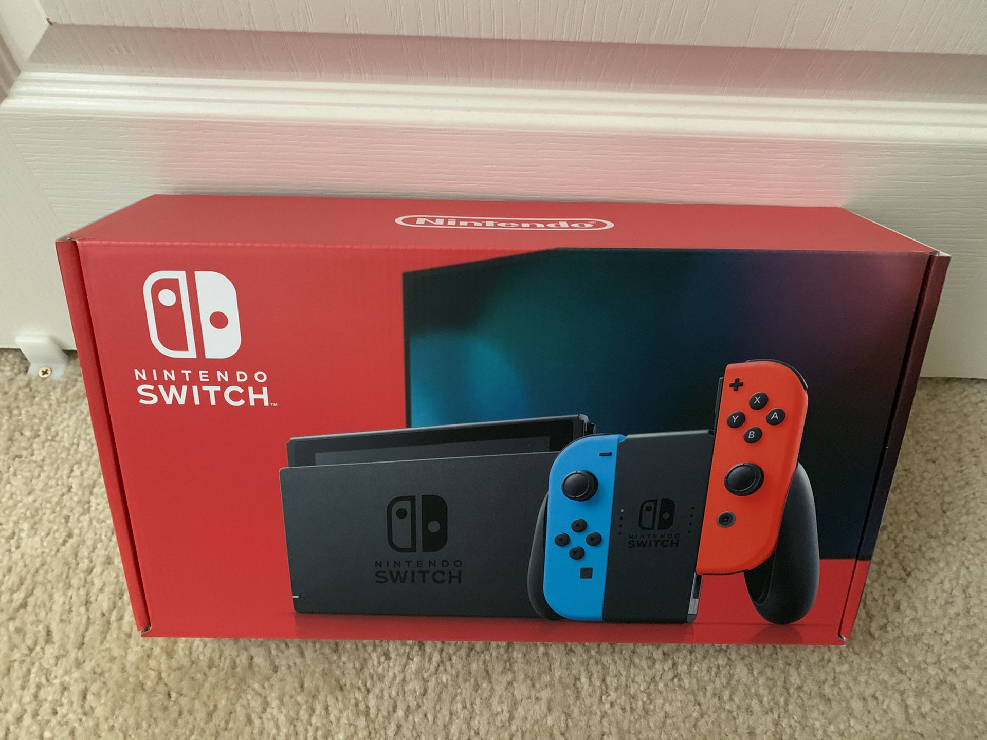 NEW - Nintendo Switch with Red/Blue Joycons