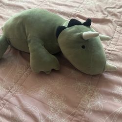 green weighted dinosaur
