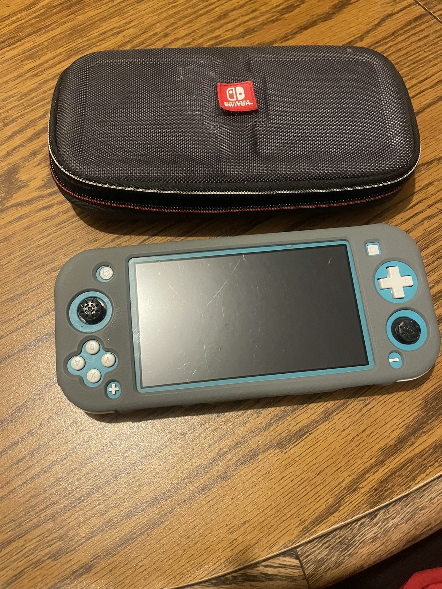 Nintendo Switch Lite W/ Super Smash Bros Game