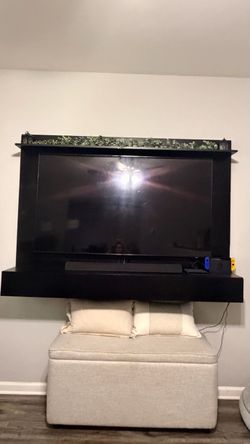 Large black entertainment center with storage