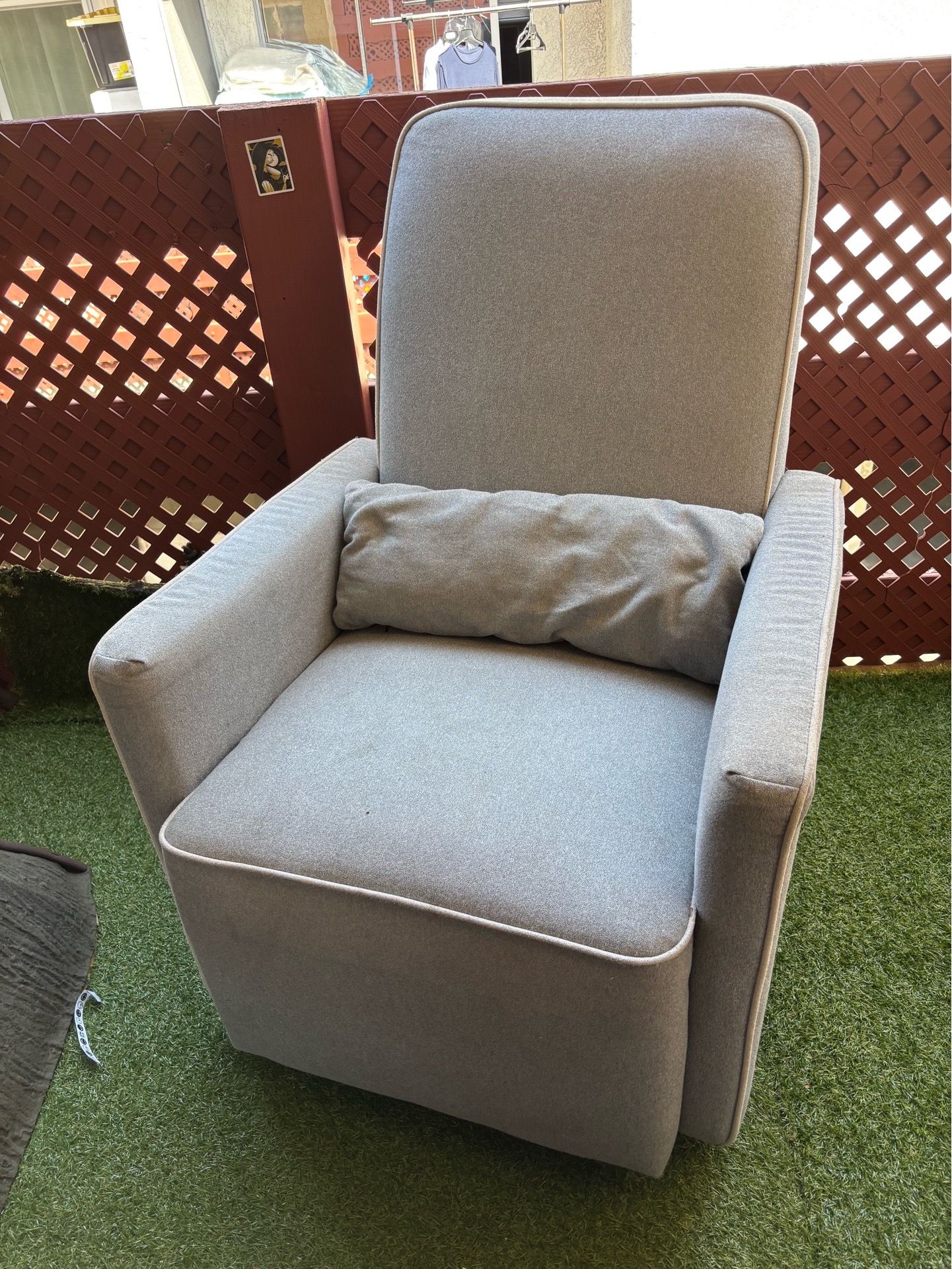 Light grey gliding/swivel chair