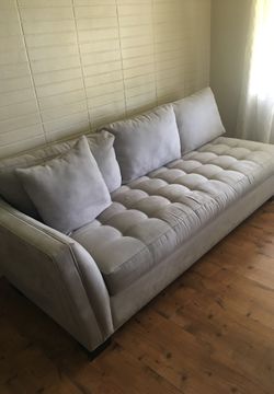 Light gray sofa from rooms to go in very good condition