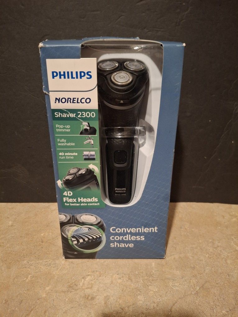 NEw Philips Norelco,23000 NEW In Box. Box Is Torn A Little At Corner