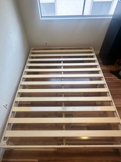 Wooden Queen-sized bed frame