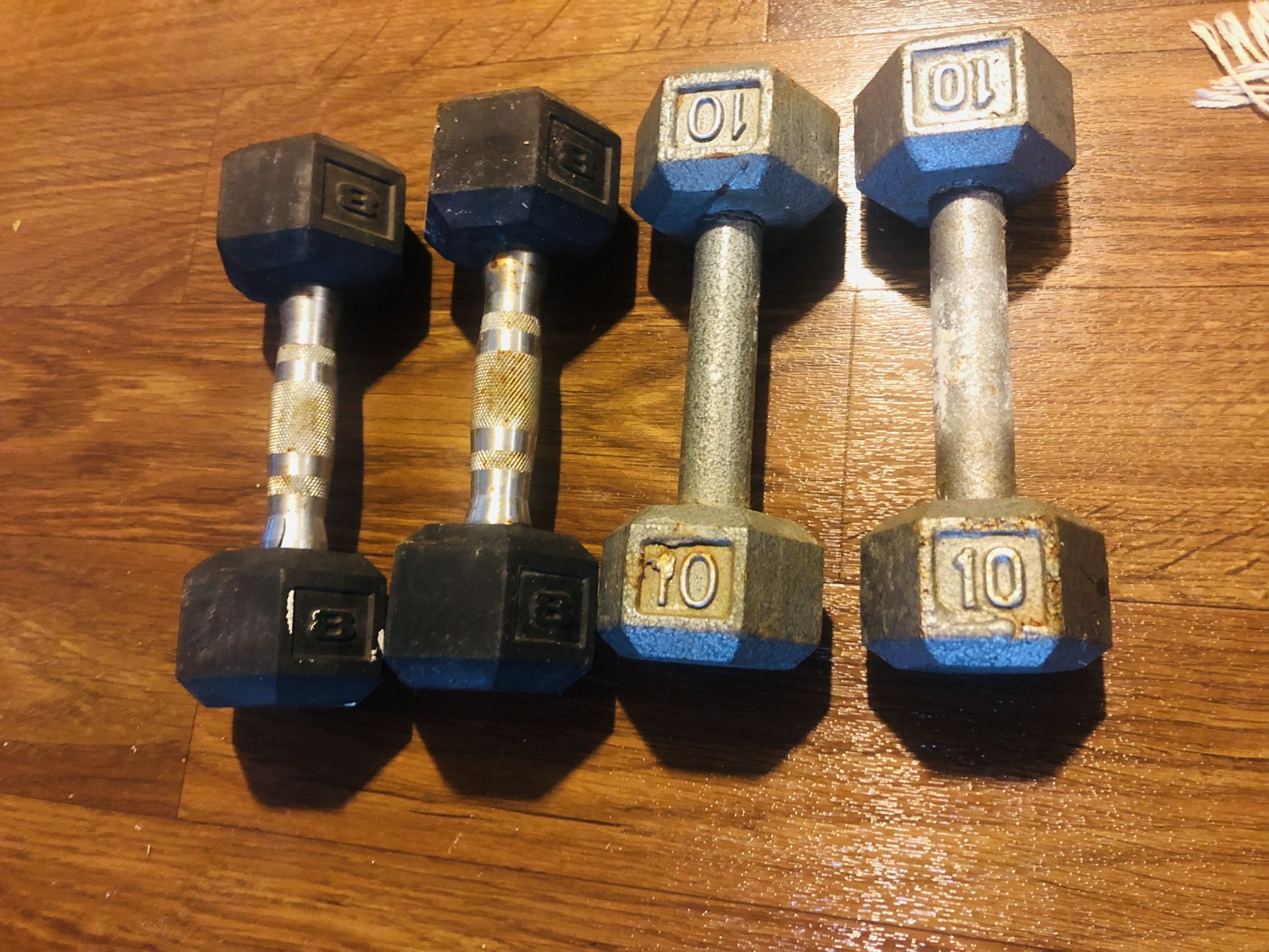 Two Sets Of Weights  10 Lbs And  8 Lbs