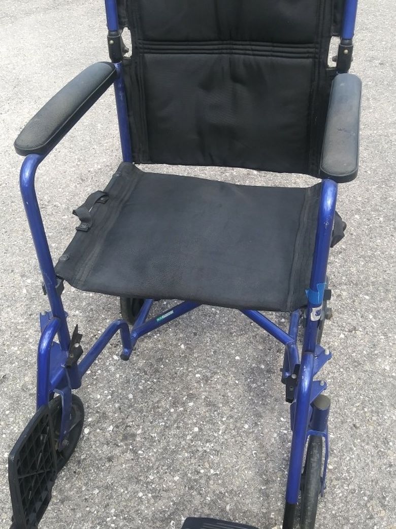 REDUCED....TRANSPORT WHEELCHAIR. (SANITIZED)