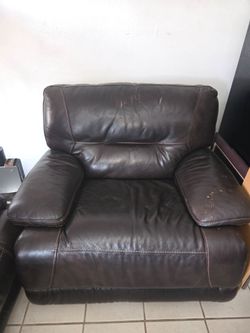 Comfortable brown leather sofa with some wear
