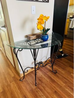 Entryway console table with a clear glass and floor clock