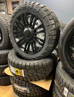 22 INCH BLACK RIMS AND TIRES DIRECT FIT NO LIFT NEEDED