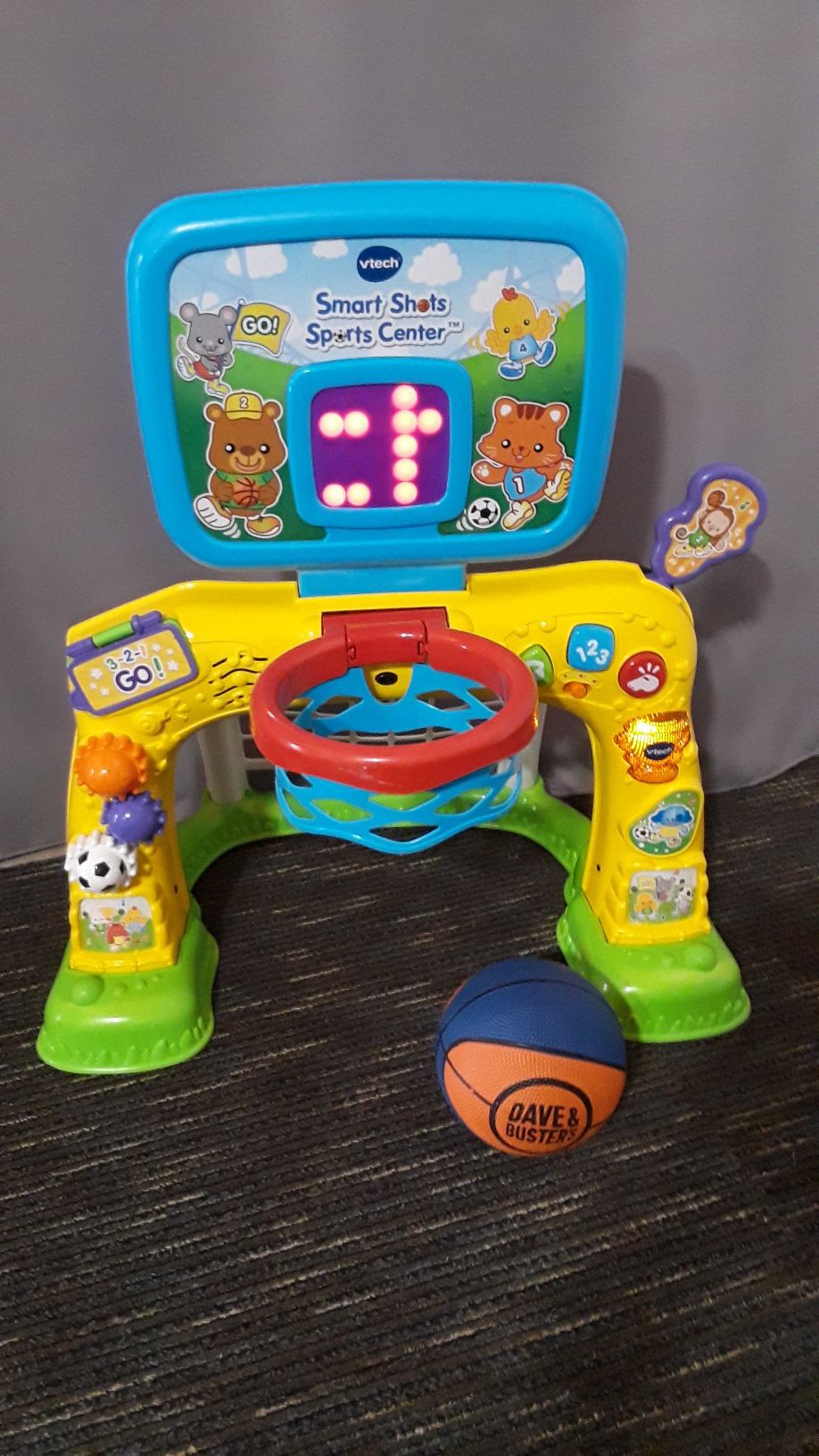 Basketball and soccer toy with music and lights, practicaly new.