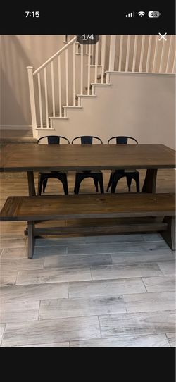 Wood table with bench and stainless steel chairs